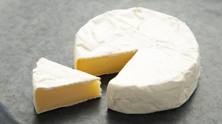 Sliced wheel of camembert cheese