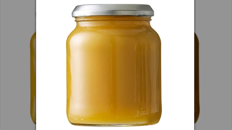 Unlabeled glass jar of applesauce