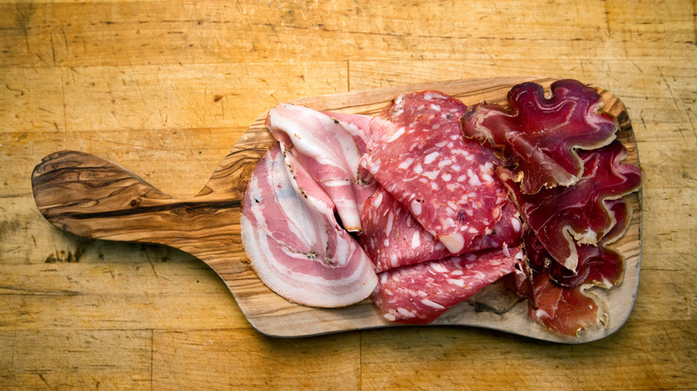 Deli meats on wooden board