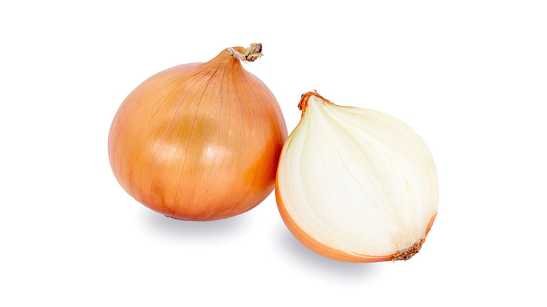 Halved yellow onion on a white background