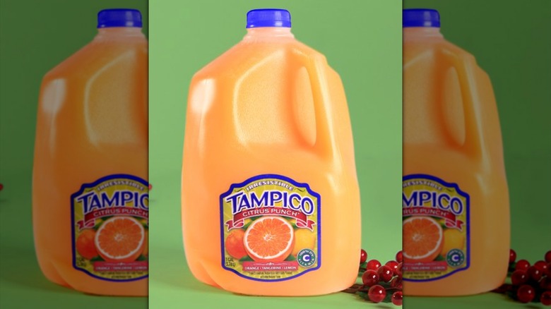 Gallon of Tampico Citrus Punch with green background