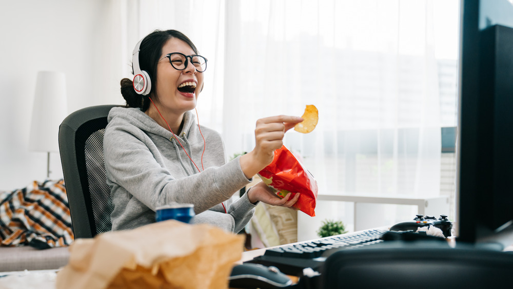 Woman eating and working