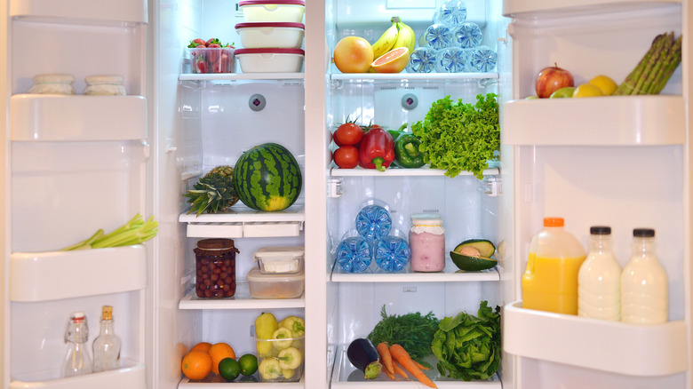 Open refrigerator filled with food