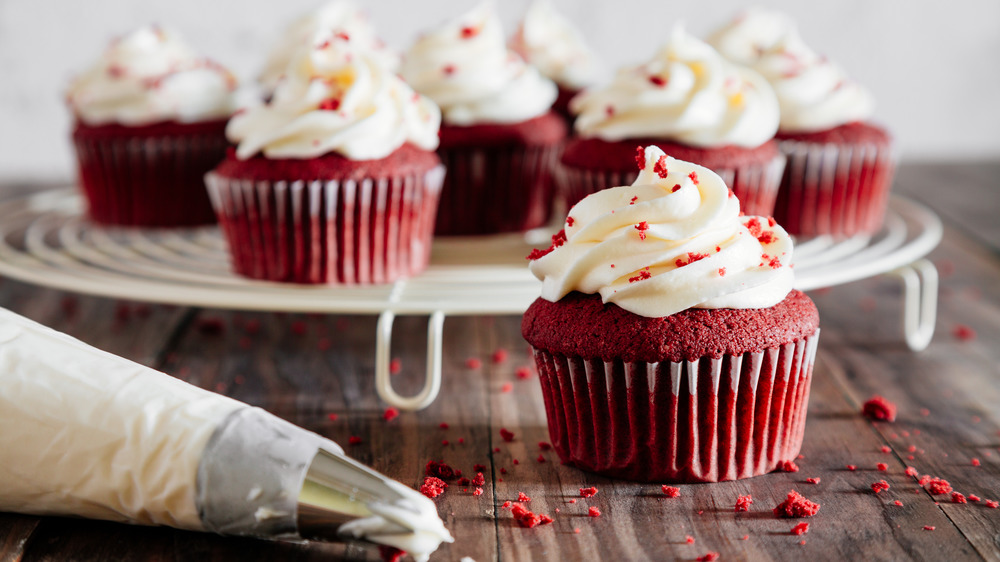 Red velvet cupcakes frosting piping bag