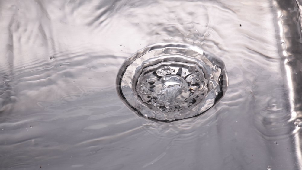 Water running down sink drain