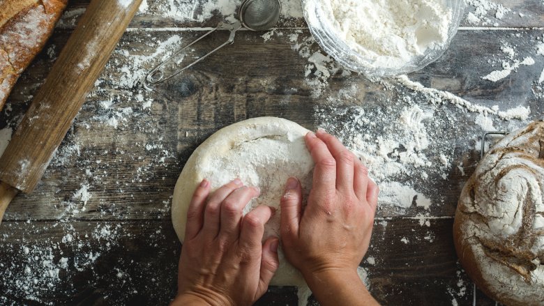 kneading flour when baking bread