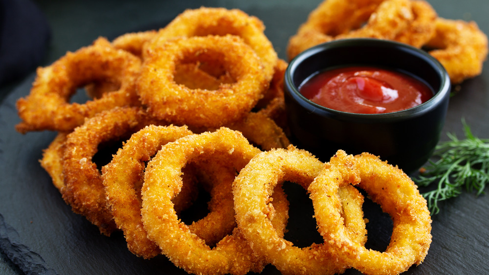 fried onion rings and ketchup