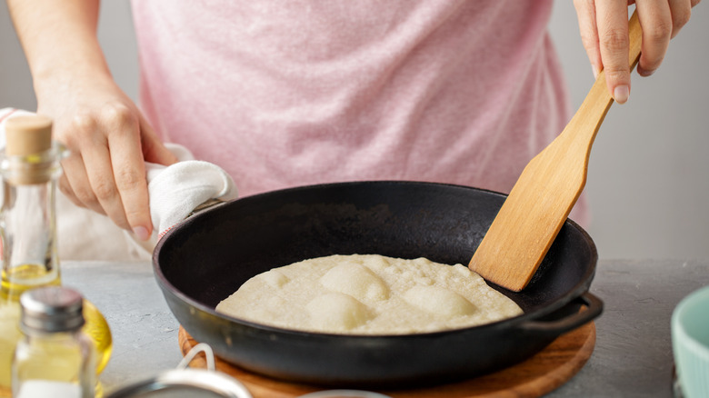 cooking tortillas on skillet 