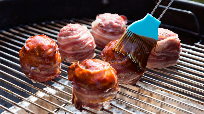 brush bbq sauce onto meatballs 