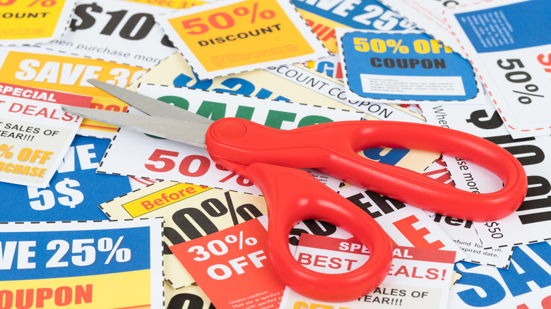 Scissors lying on coupon pile