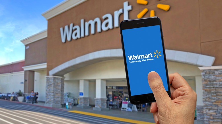 Hand with Walmart phone app