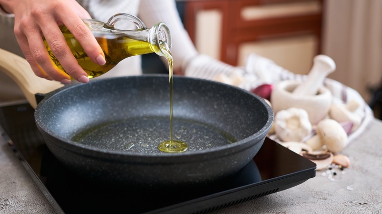 adding oil to pan before cooking mushrooms