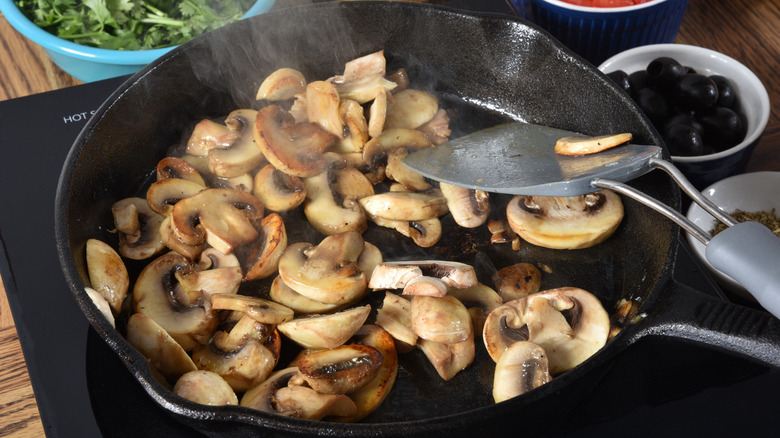 Mushrooms cooking in a pan