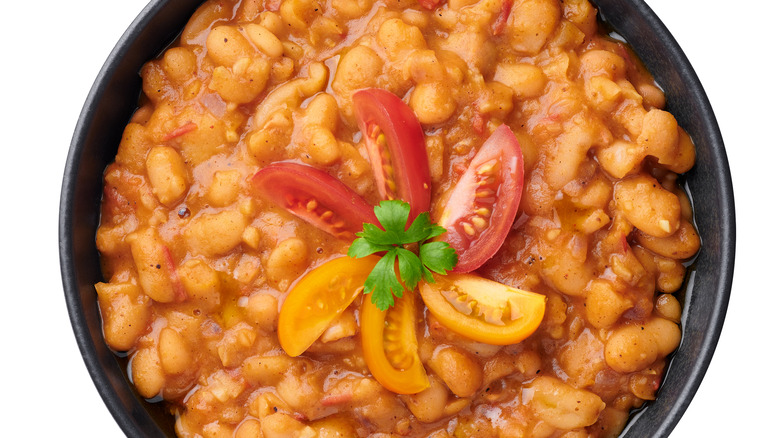 Cooked beans with tomato garnish