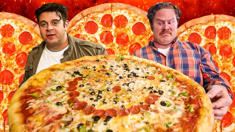 Adam Richman and Casey Webb with giant pizzas