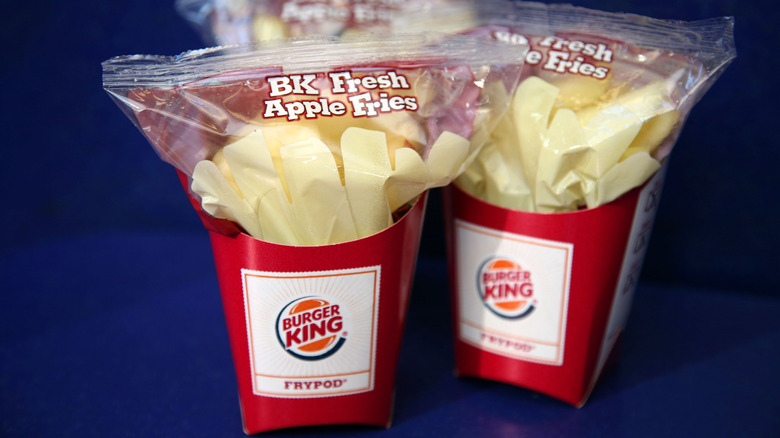 Two containers of Burger King Apple slices