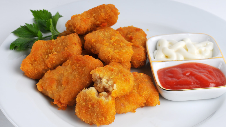 Plate of nuggets with condiments