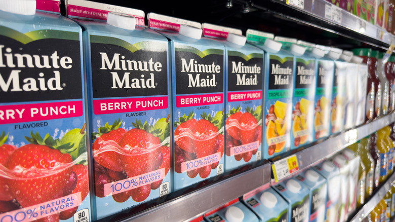 Row of Minute Maid products on shelf with focus on Berry Punch cartons