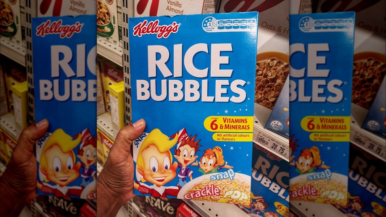 Hand holding box of Kellogg's Rice Bubbles