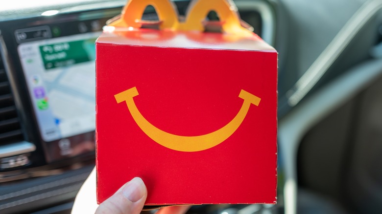 Hand holding Happy Meal box