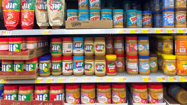 Jars of peanut butter on store shelf