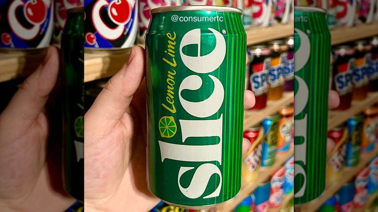 Hand holding can of Lemon Lime Slice soda