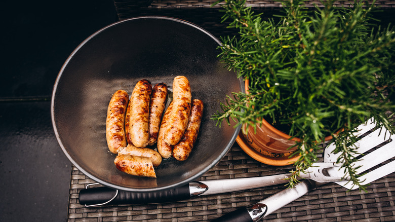 Black bowl of sausages