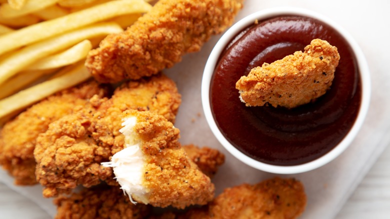 Chicken tenders with fries and sauce