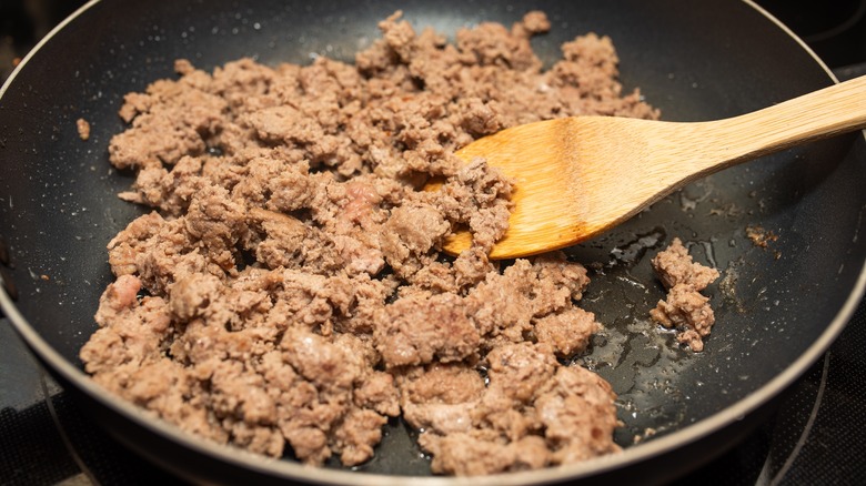 Ground turkey cooking in frying pan