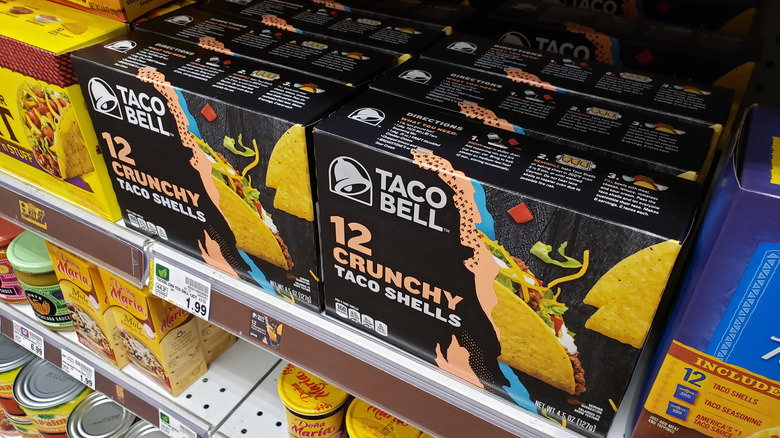 Boxes of Taco Bell crunchy taco shells on grocery shelf