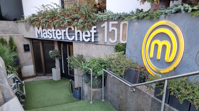 MasterChef logo above stairs