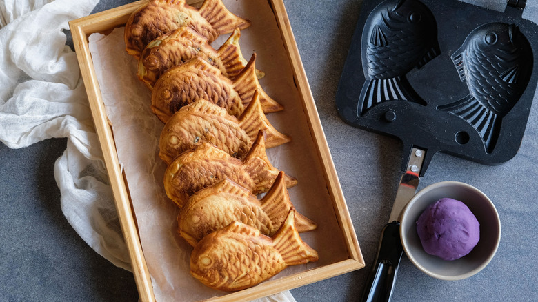 Taiyaki alongside a taiyaki maker