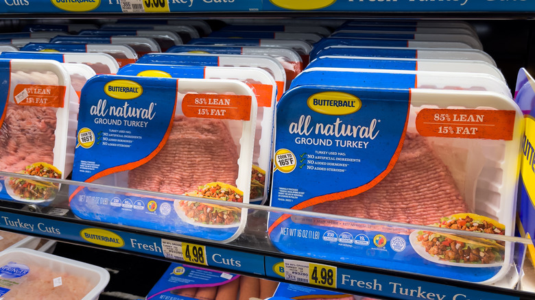 Packages of ground turkey on shelves