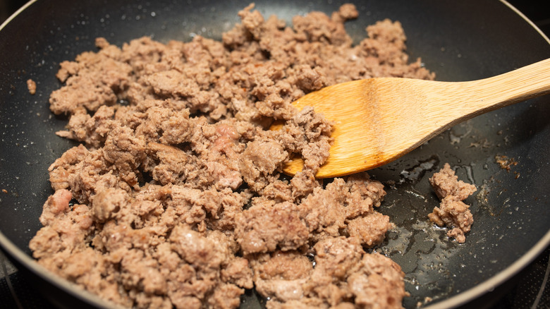 Ground turkey cooking in a pan