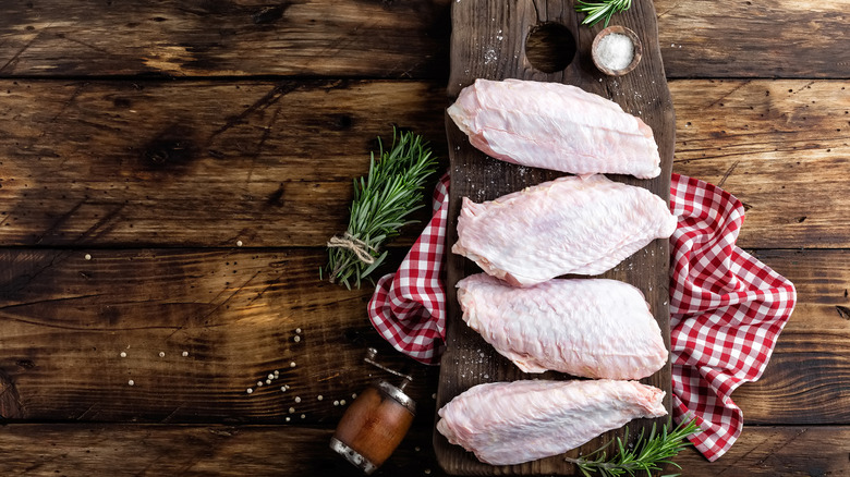 Turkey wings on a wooden board