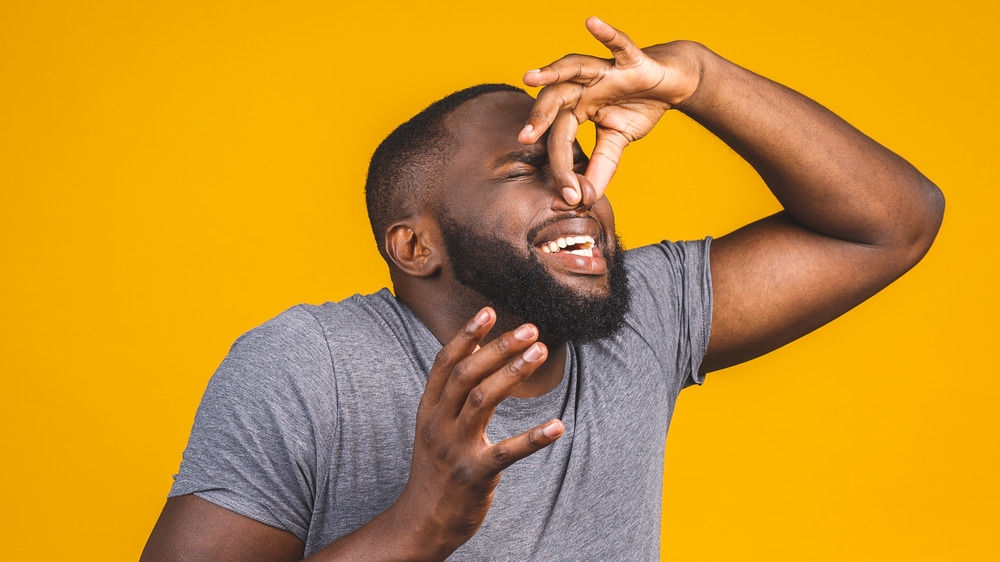 man affected by a bad smell