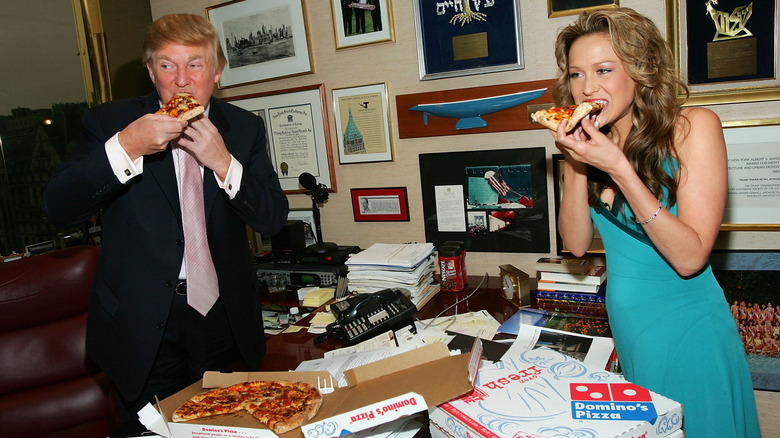 Donald Trump eating pizza with Stephanie Myers