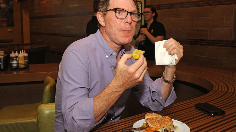 Bobby Flay eating burger 