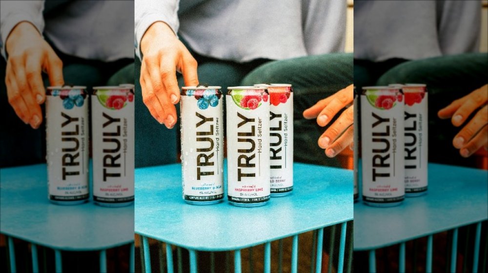 Three cans of Truly Hard Seltzer