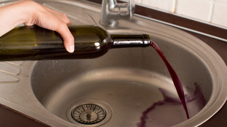 Pouring wine down the drain