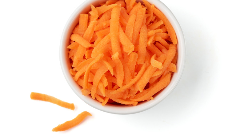 shredded carrot in a white bowl