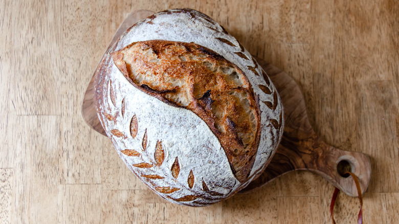 Bread scored in a pattern on wood