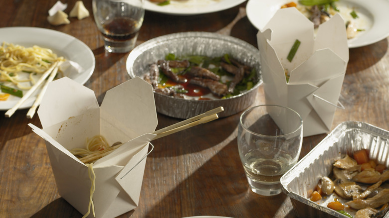 american chinese takeout boxes wooden table