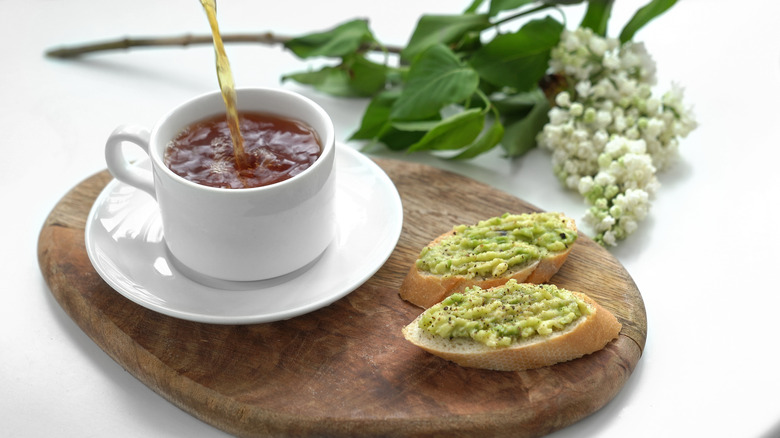 tea and bread with avocado