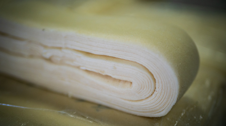 Close-up of puff pastry dough showing its layers