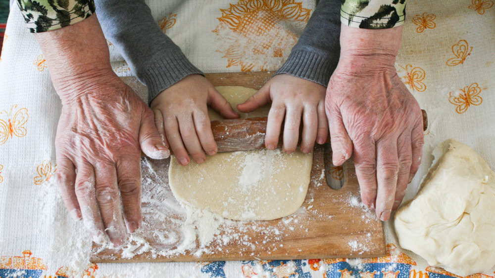 Grandmother baking with grandchild