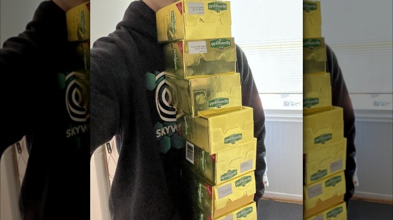 Person holding a few boxes of Kerrygold Irish butter