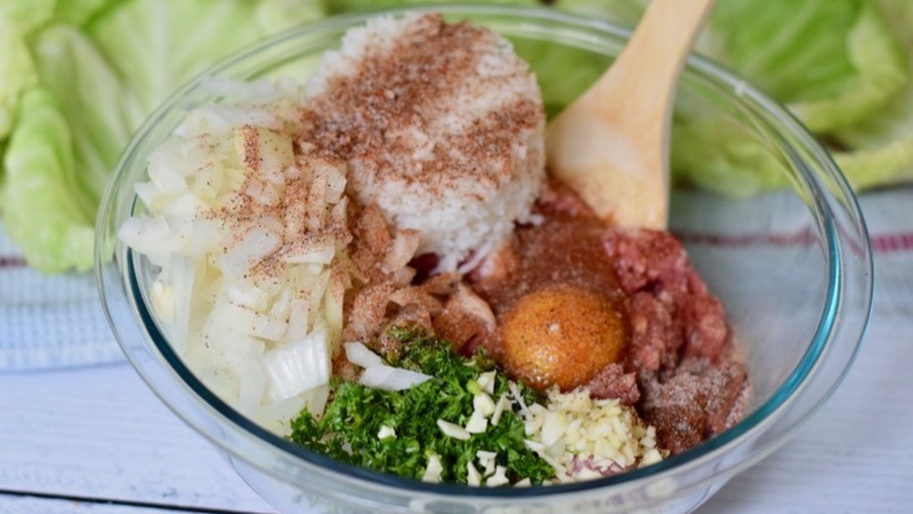 beef, pork, rice, egg, parsley, garlic, and onion filling in glass bowl