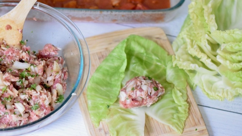 stuffing cabbage leaves with filling