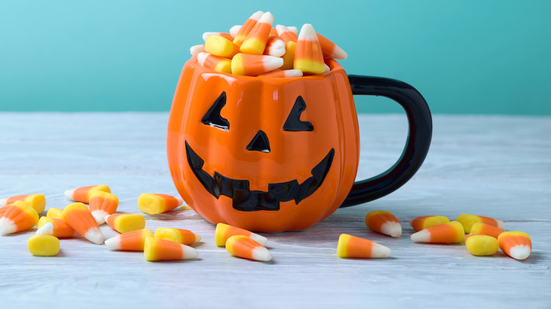 Candy corn in pumpkin mug